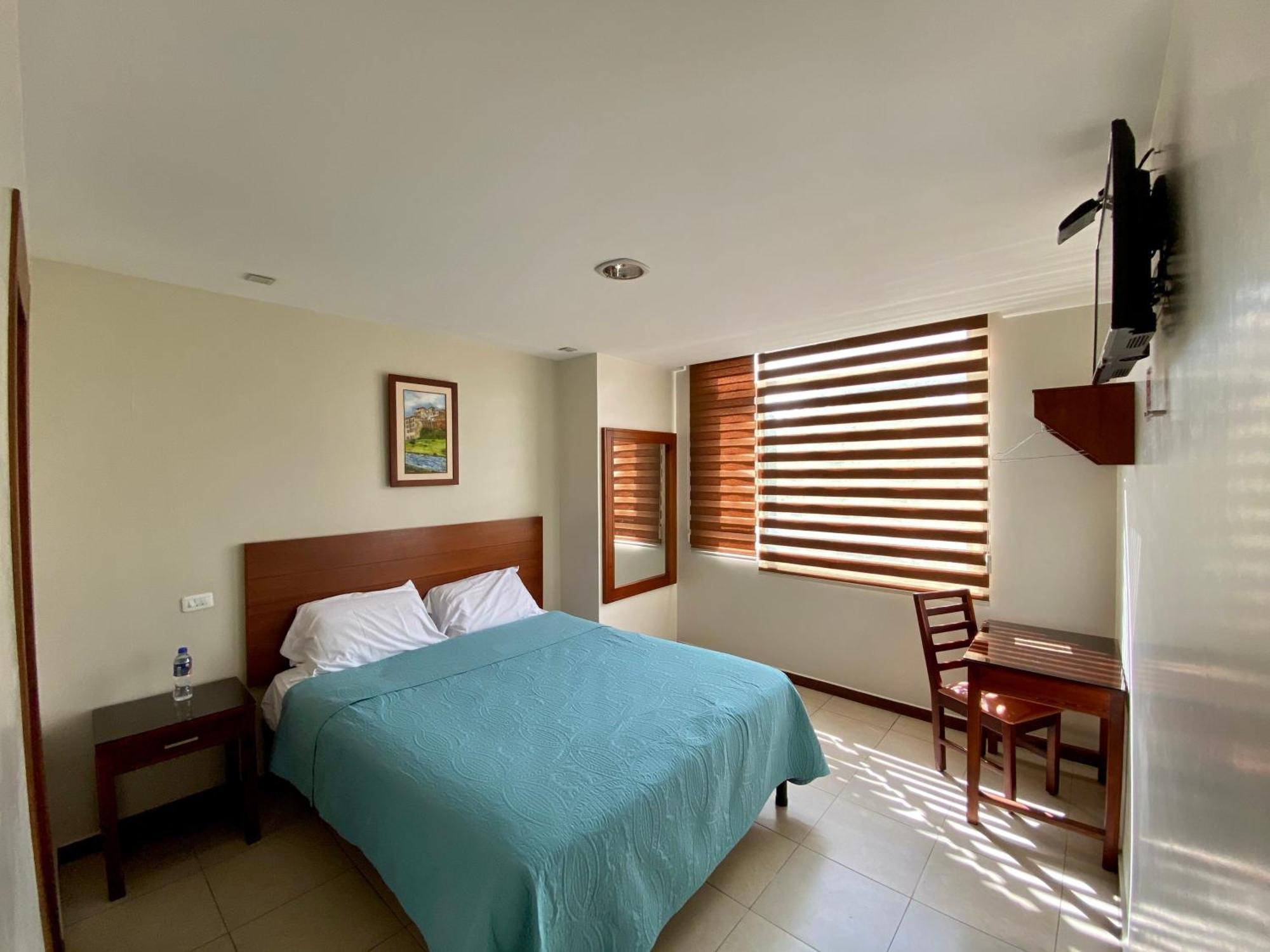 Hotel Carrion Loja Quarto foto